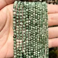 Macro view of multi-size green faceted natural stone beads for DIY jewelry making projects - Faceted Design / 2mm (Approx 170 Pieces) / Green Spotted Stone