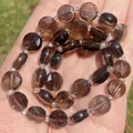 Primer plano de cuentas de cuarzo ahumado facetadas de 10x5mm para la creación de joyas DIY - Faceted Flat Round Smoky Quartz / 10x5mm (Aprox. 29 piezas) / Marrón Té