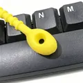 Macro view of 21cm yellow silicone cable tie with circular head and textured grip - 1 Piece / Yellow