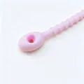 Close-up of pink silicone cable tie showing textured grip and head loop detail. - 1 Piece / Pink