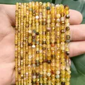 Detailed macro view of faceted yellow dragon vein agate beads for DIY handmade jewelry crafts - 190 Pieces/Pack / Amber