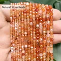 Macro view showing the detailed facets of multi-sized dragon vein agate beads in warm orange - Natural Red