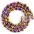 Macro-opname van iriserende ovale hematiet kralen met metaalglans voor DIY sieraden - 5-8 mm / Regenboog Glad