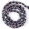 Macrobeeld van gepolijste ovale zwarte hematietkralen voor handgemaakte sieraden accessoires - 5-8 mm / Glanzend Zwart
