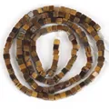 Detailed macro view of 2x2mm natural tiger eye stone square beads for DIY jewelry making - Cube Spacer (9#) / 1 Piece/Pack / Yellow Tiger Eye