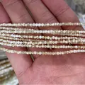 Tiras de pequeñas cuentas de concha natural de 2-3mm para la creación de joyas a mano - Estilo Trochus / Tamaño 2mm / Color Natural de Trochus