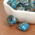 Macro view of blue heart-shaped imperial turquoise beads with unique natural patterns. - Horizontal Hole Heart Shape / 2 Pieces/Pack (15mm) / Light Blue