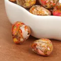 Macro detail of 15mm heart-shaped multi-color imperial jasper beads with horizontal holes. - Horizontal Hole Heart Shape / 2 Pieces/Pack (15mm) / Orange