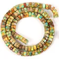 Macro detail view of 6x3mm multi-colored imperial jasper natural stone spacer beads - Colorful Imperial Stone