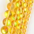 Macro view of translucent yellow natural stone round beads for jewelry making - 6mm (Approx 58 Pieces/Pack) / Polished Yellow Flash Stone
