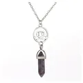 Close-up of a natural amethyst crystal pendant with a hollow lotus flower design - Lotus / Amethyst
