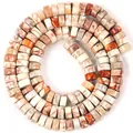 Close-up detail of 6x3mm natural imperial jasper heishi beads for jewelry making - Cream White Emperor Stone