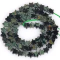 Macro detail of 6mm star-shaped green aventurine stone beads for jewelry making DIY - 1 Strand Approx 68 Pcs (6x2mm) / Variscite