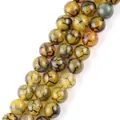 Detailed macro view of yellow dragon vein agate round beads for jewelry making. - 6mm (Approx 58 Pieces/Pack) / Yellow Dragon Vein Agate
