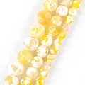 Detailed view of yellow dragon vein agate round beads for DIY jewelry making - 6mm (Approx 58 Pieces/Pack) / Yellow and White Faceted Fire Agate