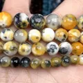 Detailed macro view of natural yellow and black patterned stone beads for DIY jewelry making - 6mm (Approx 58 Pieces/Pack) / Yellow and Black Persian Jade