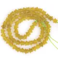 Close-up detail of 6mm star-shaped yellow natural stone beads for handmade DIY jewelry making - 1 Strand Approx 68 Pcs (6x2mm) / Lemon Yellow