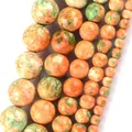 Close-up of orange and green marbled natural stone round beads in multiple sizes - 6mm (Approx 58 Pieces/Pack) / Yellow and Green Rain Stone