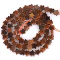 Close-up macro view of 6mm star-shaped natural stone beads for DIY jewelry accessory making - 1 Strand Approx 68 Pcs (6x2mm) / Yellow Tiger Eye