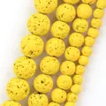 Macro detail of porous yellow volcanic lava stone round beads for DIY jewelry making - 6mm (Approx. 58 Pieces) / Yellow Hematite Volcanic Stone