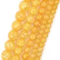 Macro view of yellow natural stone beads showing detailed interior crackle texture and gloss. - 6mm (Approx 58 Pieces/Pack) / Golden Yellow Crackle