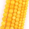 Detailed view of yellow natural stone round loose beads for DIY bracelet and necklace jewelry - 6mm (Approx. 58 Pieces) / Frosted Yellow Honey Wax Jade