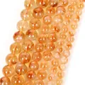 Macro detail of natural yellow round stone beads for handmade jewelry bracelet making - 6mm (Approx. 58 Pieces) / Natural Citrine (Uncolored)