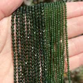 Macro detail of 2mm to 4mm faceted green natural stone beads for DIY jewelry making - 2mm Approx 170 Pieces / Green Sandstone
