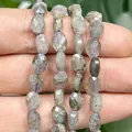 Handheld view of 6x8mm faceted flat oval natural labradorite stone beads for DIY jewelry - Faceted Flat Oval / 23 Pieces/Pack (6x8mm) / Labradorite