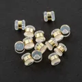 Detailed macro view of transparent silicone hamburger earring backs with gold metal rings - Cylinder Studded / 5.5*5mm / Gold