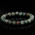 Natural green stone bead bracelet with unique textures on black background - African Pine Stone (B0100) / 19cm 6mm