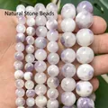 Macro view of polished purple and white marbled Persian jade round beads for jewelry - 6mm / Purple and White Persian Jade