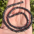 Detailed close-up of 5x12mm black bamboo shaped natural stone beads for DIY jewelry making - One Strand Approx 31 Pieces (5x12mm) / Obsidian