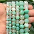 Macro view of green dragon vein agate round beads for DIY jewelry making - Turquoise Silk Agate