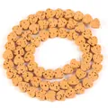 Macro detail of heart-shaped natural volcanic stone loose beads for DIY jewelry making - 6x7mm (Approx 60-62 Beads) / Turmeric