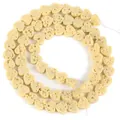 Detail view of cream heart-shaped porous volcanic stone beads for DIY jewelry making - 6x7mm (Approx 60-62 Beads) / Bright yellow