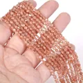 Close-up view of 4mm faceted natural sunstone disk beads for DIY jewelry making craft - 1 Strand Approx 98 Beads (4mm) / Golden Strawberry