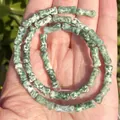 Detailed macro shot of 5x12mm natural green bamboo-joint stone beads for jewelry DIY - One Strand Approx 31 Pieces (5x12mm) / Green Spotted Stone