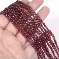 Close-up of 4mm faceted red natural stone beads for DIY necklace and bracelet crafting - 1 Strand Approx 98 Beads (4mm) / Purple Pomegranate