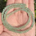 Macro view of 5x12mm natural green bamboo-joint jade beads for DIY jewelry making accessories - One Strand Approx 31 Pieces (5x12mm) / Green Aventurine