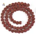 Detailed view of heart-shaped natural red lava stone beads with porous texture - 6x7mm (Approx 60-62 Beads) / Brown