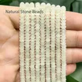 Vista detallada de cuentas espaciadoras de piedra natural verde claro 2x4mm para joyería - Cuenta de Ábaco de Cuarzo Verde / 4x2mm Aprox 160 Piezas Por Hilo