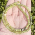 Close-up of 5x12mm bamboo-joint shaped natural pale green stone beads for DIY jewelry - One Strand Approx 31 Pieces (5x12mm) / China Jade