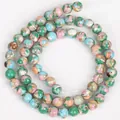 Nahaufnahme von marmorierten blau-grünen Muschelstein-Rundperlen für DIY-Schmuck - Rosa Grüner See-Muschel-Stein / 6mm (ca. 60 Stk.) / Rosa und Grün