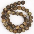 Detailed view of green-brown weathered agate beads for DIY bracelet and necklace making. - 10mm / Coffee