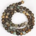 Detailed macro view of green coffee weathered agate beads for DIY jewelry making material. - 6mm / Green & Brown