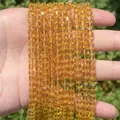 Close-up of faceted amber crystal cube beads showing intricate light refraction details - 1 Strand (Approx. 95 Pcs) / Light Yellow