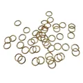 Close-up view of numerous rose gold open jump rings used for DIY jewelry making crafts - 0.7*5mm / KC Gold