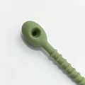 Close-up of a 21cm avocado green thick silicone cable tie for DIY jewelry and crafts - 1 Piece / Light Avocado Green