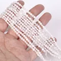 Close-up of 4mm faceted white moonstone rondelle beads for jewelry making - 1 Strand Approx 98 Beads (4mm) / Moonbeam
